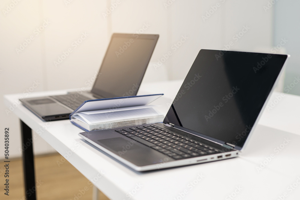 stylish working laptops on the table in the office stylish working laptops on the table in the office