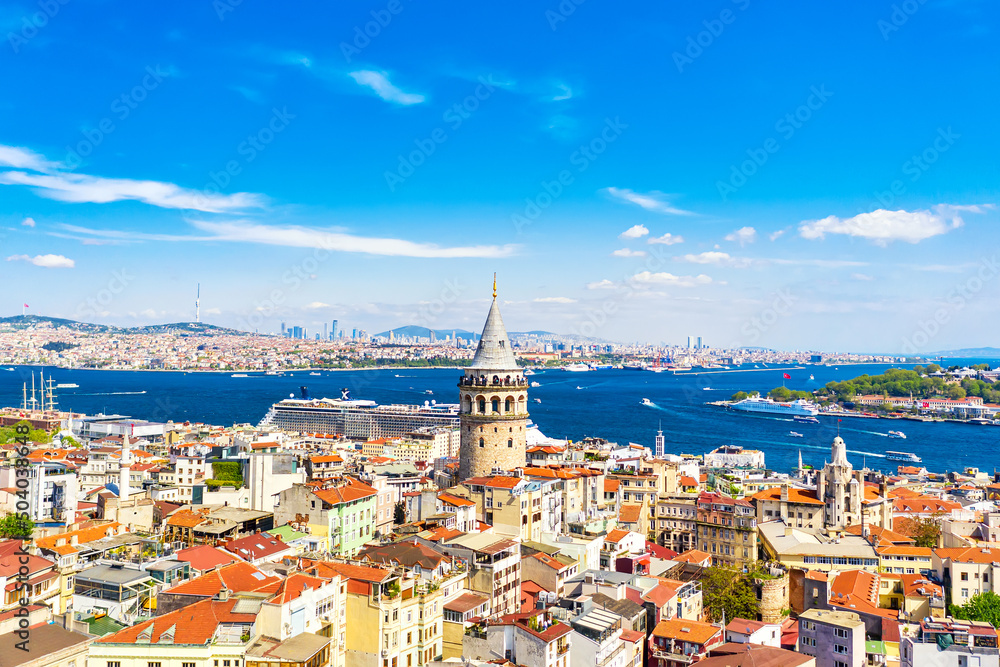 Fototapeta premium Aerial drone view of Galata Tower with cruise liner in Istanbul, Turkey. Summer sunny day