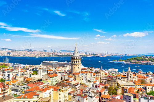 Aerial drone view of Galata Tower with cruise liner in Istanbul, Turkey. Summer sunny day
