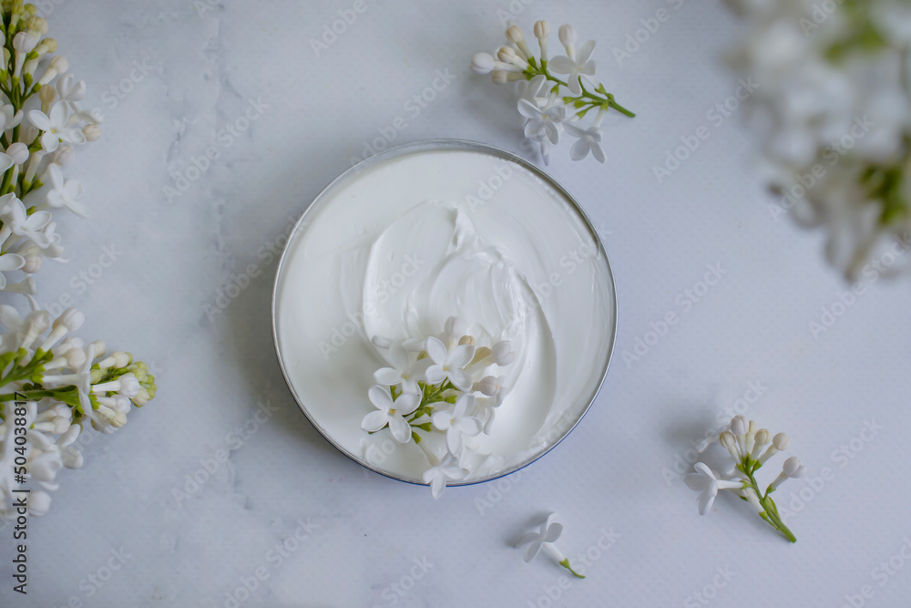 cream cosmetic lilac flower background cream cosmetic lilac flower background