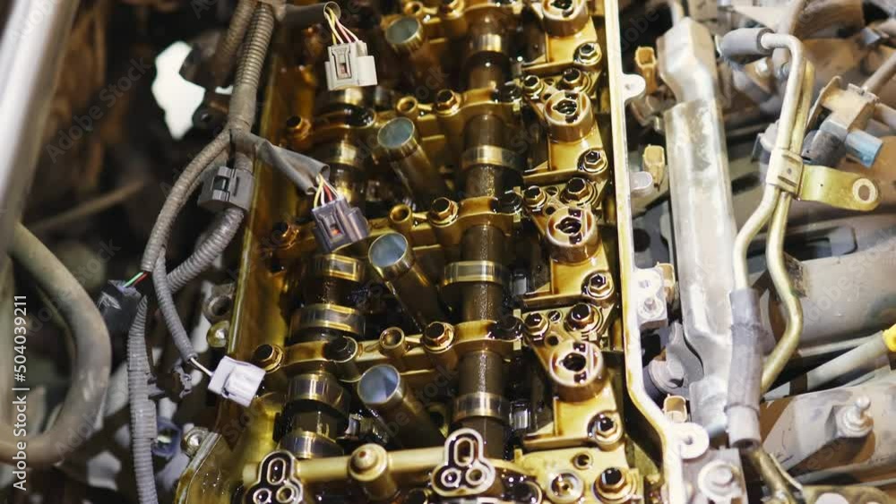 closeup car engine valvematic cover inside and outside, repairmen