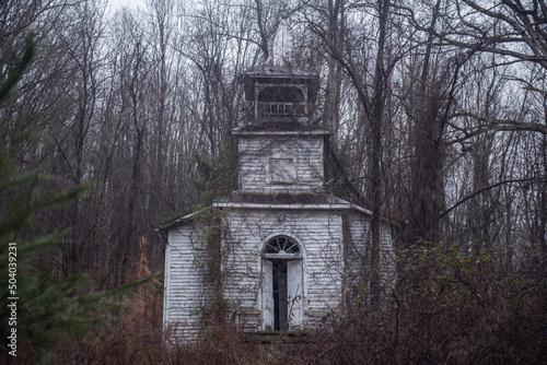 Canvas Print A Virginian church slowly consumed by kudzu.