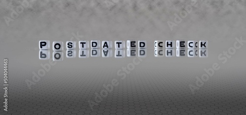 postdated check word or concept represented by black and white letter cubes on a grey horizon background stretching to infinity