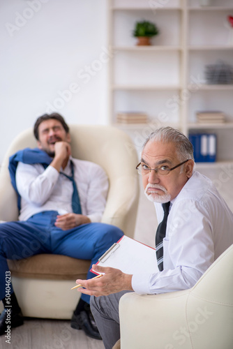 Young businessman employee visiting psychologist