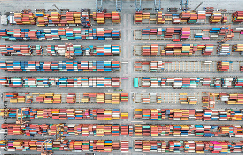 Aerial view Container at industrial ports in the business of import, export, logistics and international maritime transport, loading of containers with cranes,