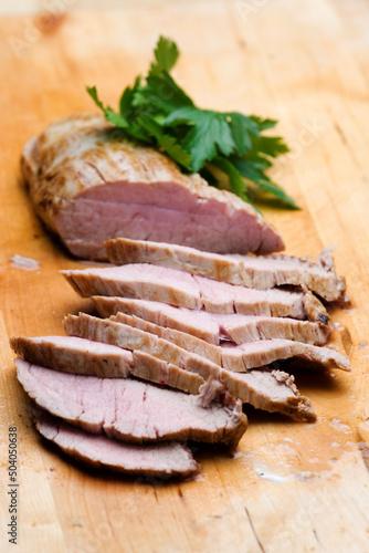 Pork loin slices on cutting board