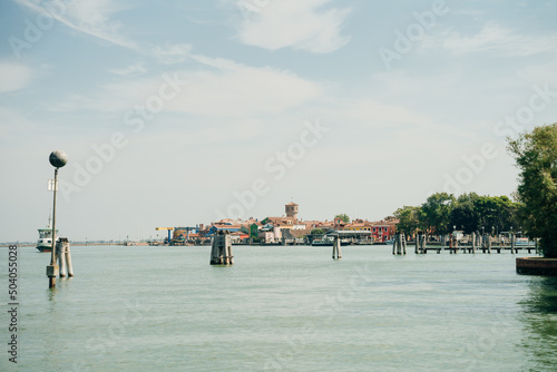 View of the San Michele Arcangelo bell tower and the colorful houses of Mazzorbo, Venice - sep, 2021 photo