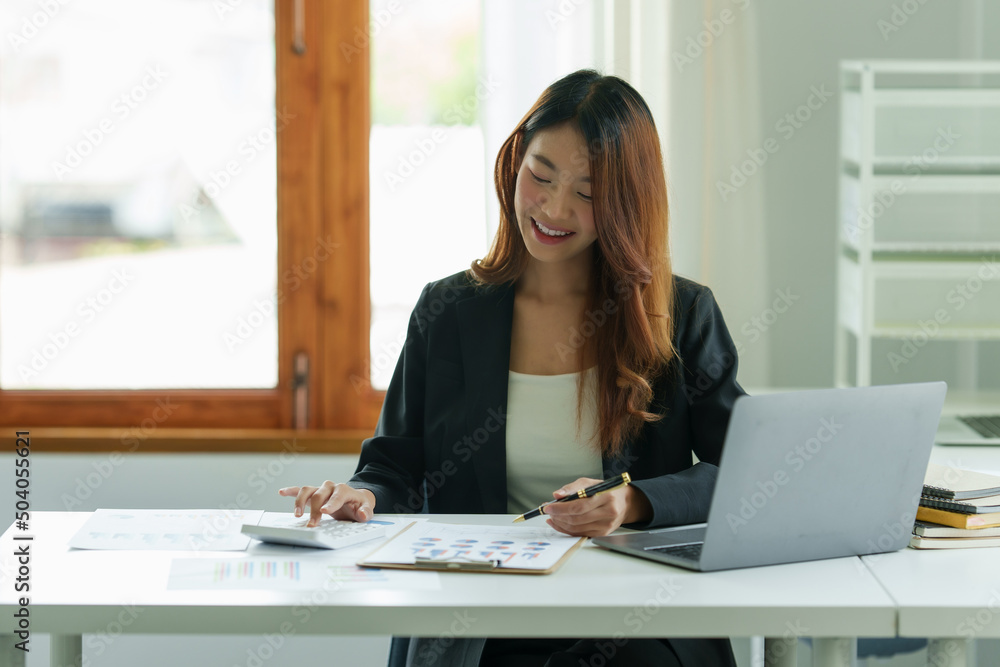 Close up Business woman hand using calculator to calculate the company's financial results and budget. Account Audit Concept. Close up Business woman hand using calculator to calculate the company's financial results and budget. Account Audit Concept.