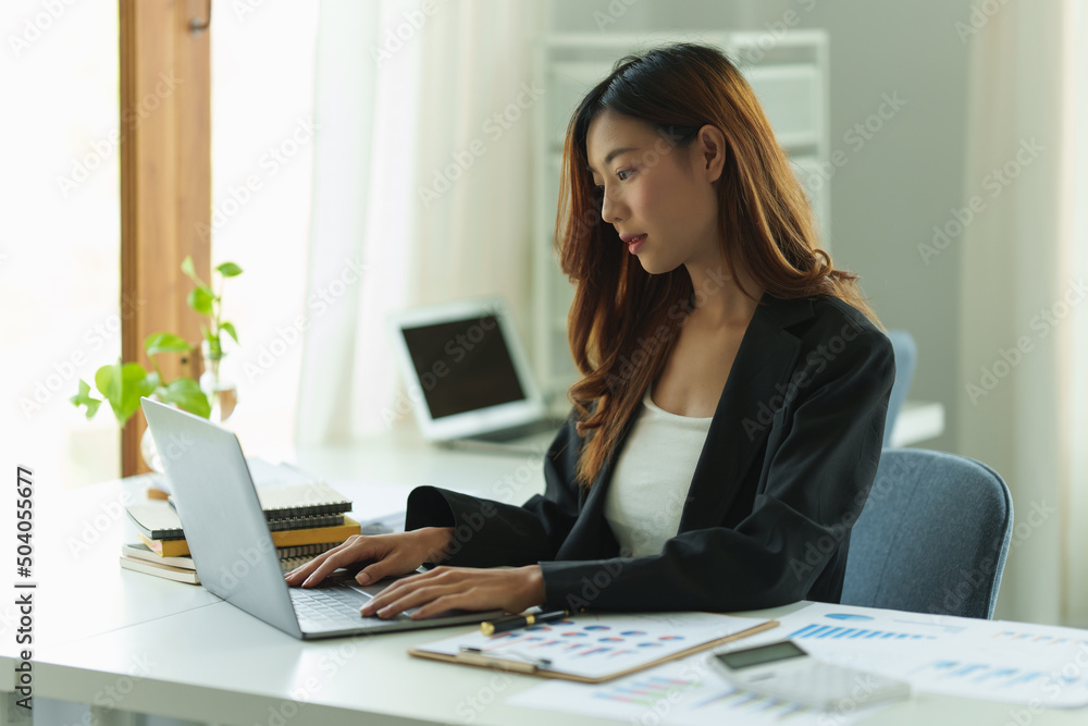 .Businesswoman in having a video call on laptop while discussion with business partner during work from home. .Businesswoman in having a video call on laptop while discussion with business partner during work from home.