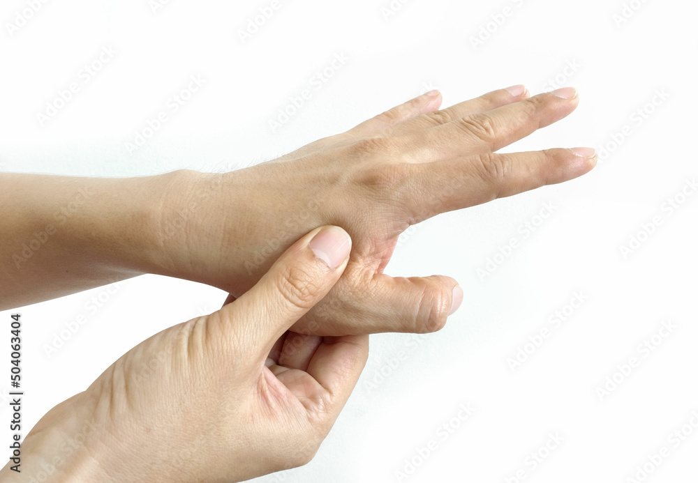 The young man's hand squeezed and massaged his thumb on his thumb. He had numbness and cramping. Locked fingers. from office syndrome The young man's hand squeezed and massaged his thumb on his thumb. He had numbness and cramping. Locked fingers. from office syndrome