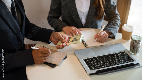 Businessman making presentation with his colleagues and business tablet digital computer .