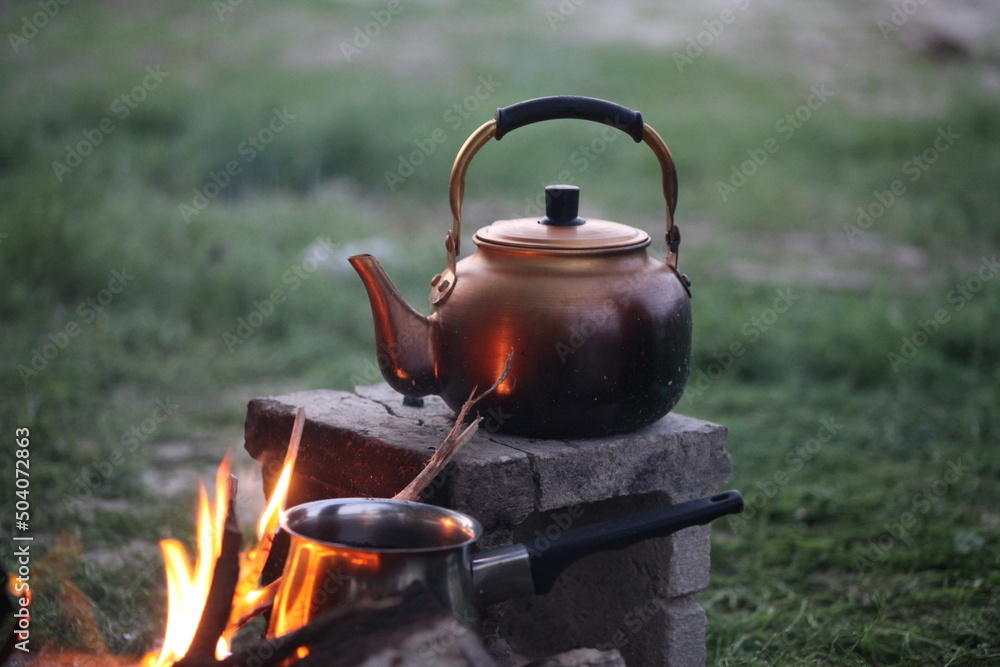 A teapot on charcoal, the simple Arabic style A teapot on charcoal, the simple Arabic style