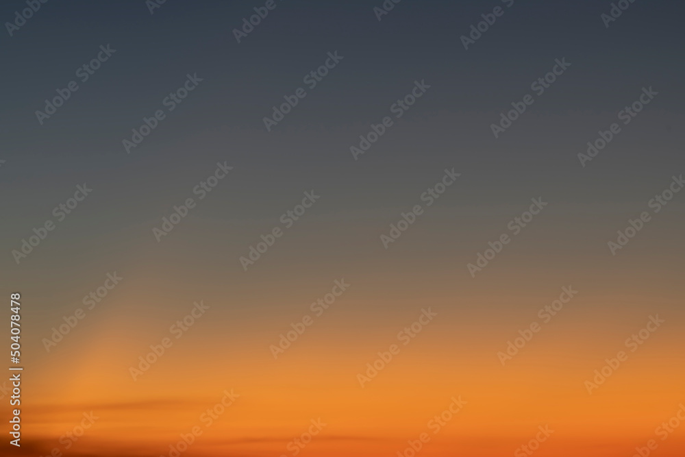 Fototapeta premium Sky gradient from blue to orange sunset