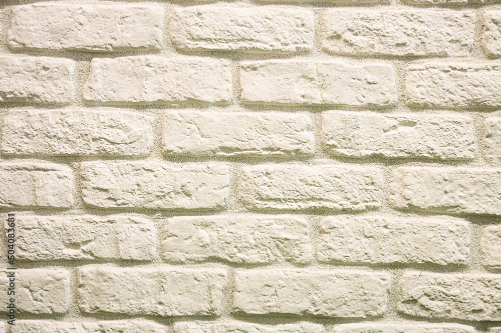 Fototapeta premium Stone wall brick texture. Empty white brick wall in room. Textured and background