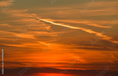 Amazing orange summer sunset with spectacular clouds on sky. Great landscape good to be used as background. © Dragoș Asaftei