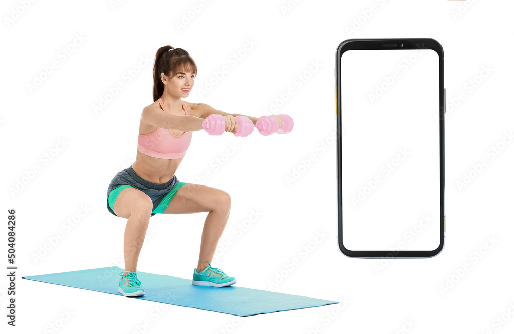 Fototapeta premium Sporty young woman training with dumbbells on white background