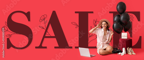 Young woman with laptop and...