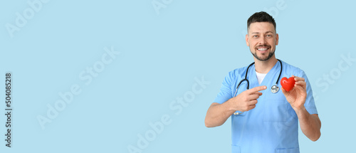 Male cardiologist on light ...