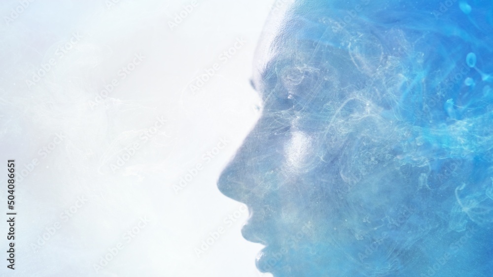 Spiritual aura. Inner peace. Enlightenment mindfulness. Double exposure closeup profile silhouette of relaxed woman face with blue mist cloud isolated on white copy space.