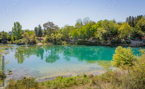 Backwater with emerald water behind the Manavgat waterfall in Side, Turkey