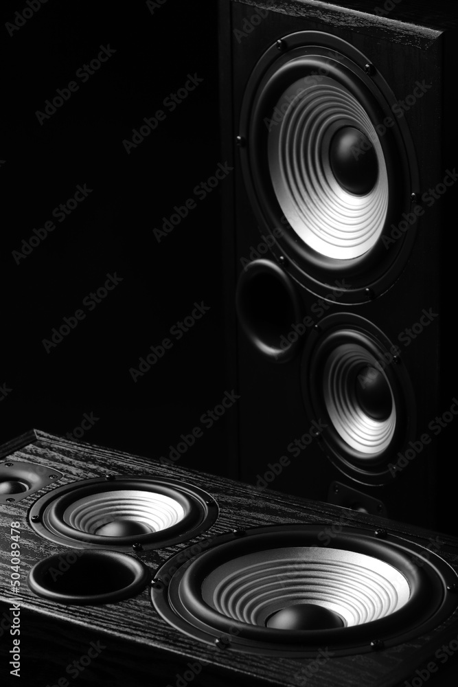 Modern loudspeakers on black background Modern loudspeakers on black background