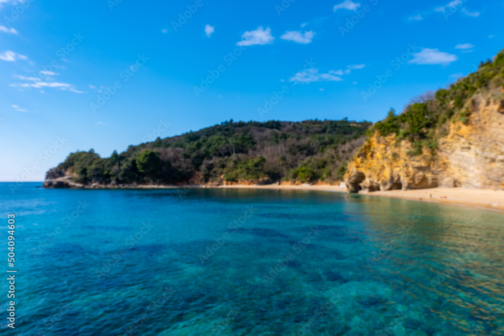 Blue water and rocks on the beach near Budva, Montenegro.