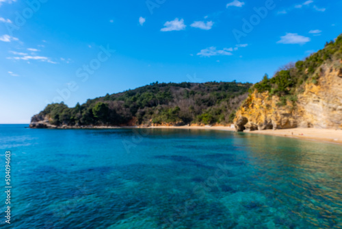 Blue water and rocks on the beach near Budva, Montenegro. © dtatiana