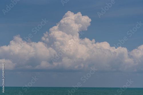 Blue sky, white cloud and calm sea water, sunny day