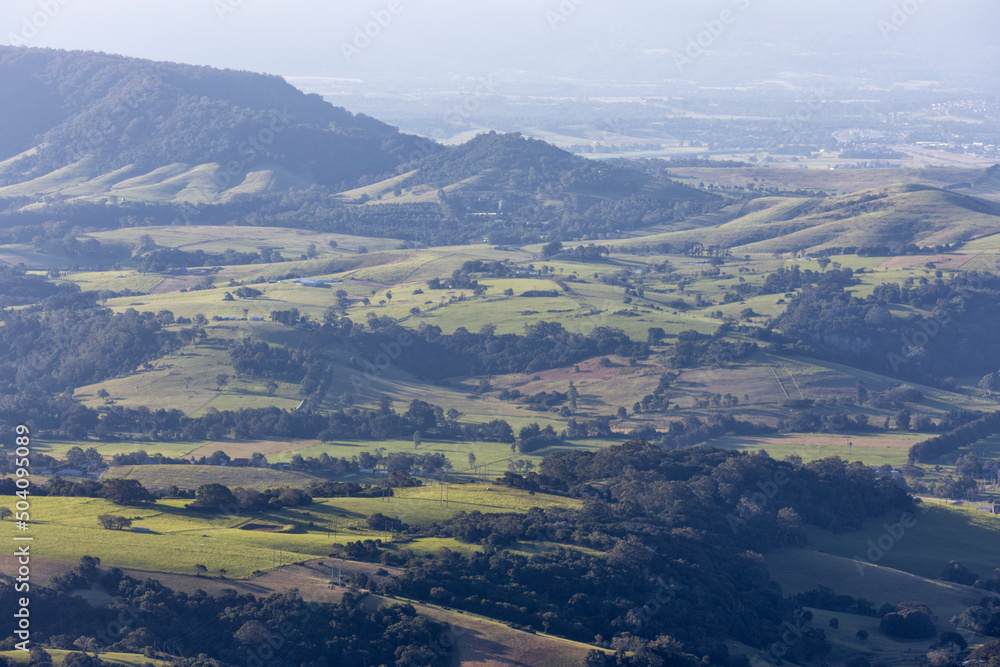 a view of a large mountain and regional land in the background a view of a large mountain and regional land in the background
