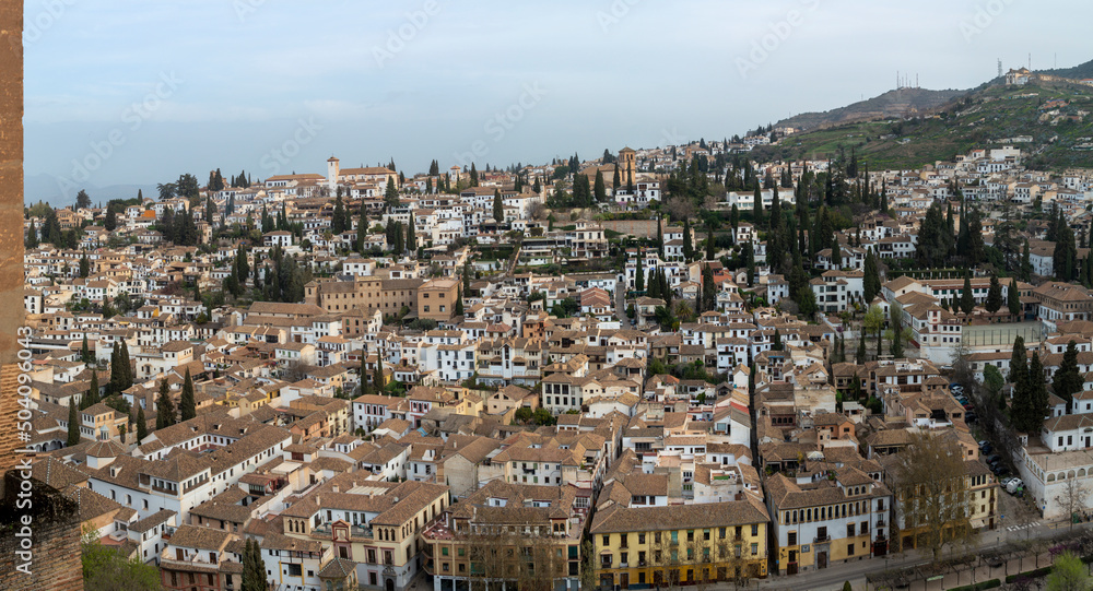View from medieval fortress Alhambra to white houses of Albaicin, Granada, Andalusia, Spain