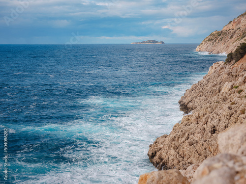 nobody on Seyrek CakIl beach , Mediterranean coast Sea, Kas, Turkey. Lycia coast on winter day during vacation photo