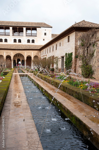 Gardens and buidings of medieval palace Generalife in fortress Alhambra, Granada, Andalusia, Spain