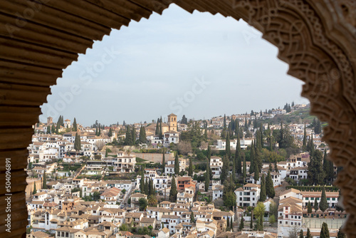 View from medieval fortress Alhambra to white houses of Albaicin, Granada, Andalusia, Spain
