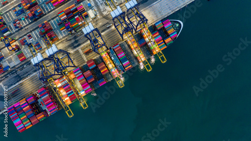 Container cargo ship at industrial port in import export commercial trade global business logistic and transportation of international container cargo ship boat, Aerial view container commercial port.