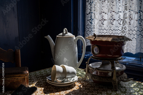 Old fashioned Dutch interior, tableware and room decoration in small fisherman's houses in North-Holland, Enkhuizen, Netherlands photo