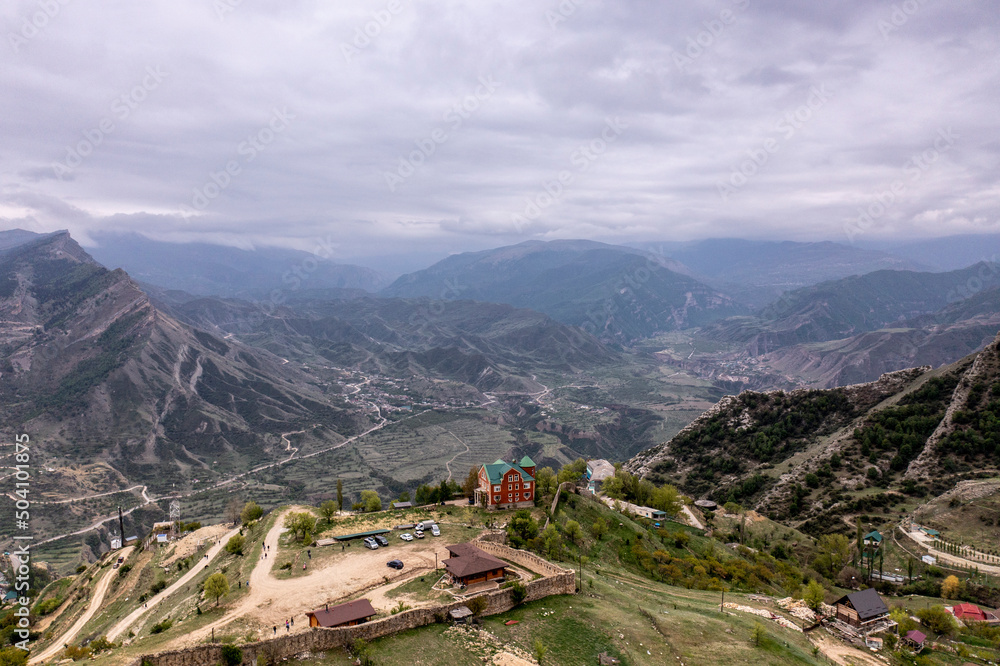 panoramic view of the Caucasus mountains gorges ancient fortresses and curved mountain roads on a spring day