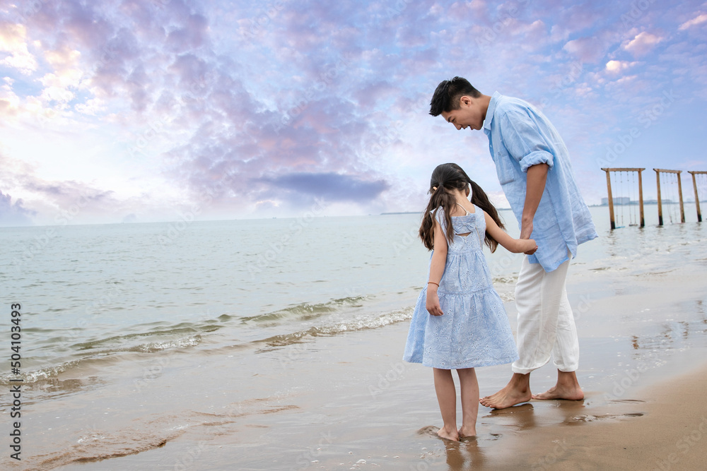 Happy father and daughter playing on the beach Happy father and daughter playing on the beach
