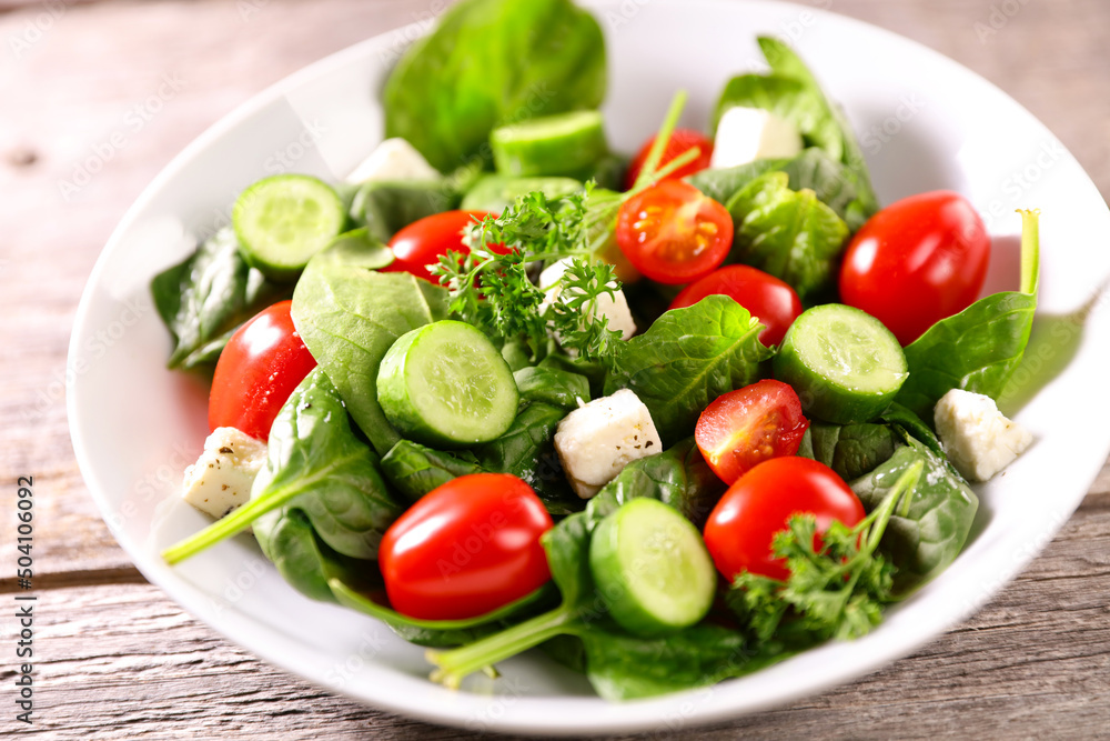 vegetable salad with cucumber, tomato and spinach