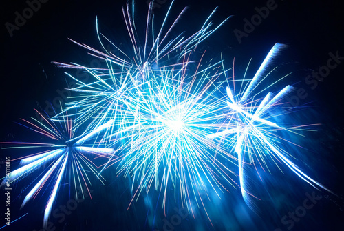 Blue fireworks on night black sky background