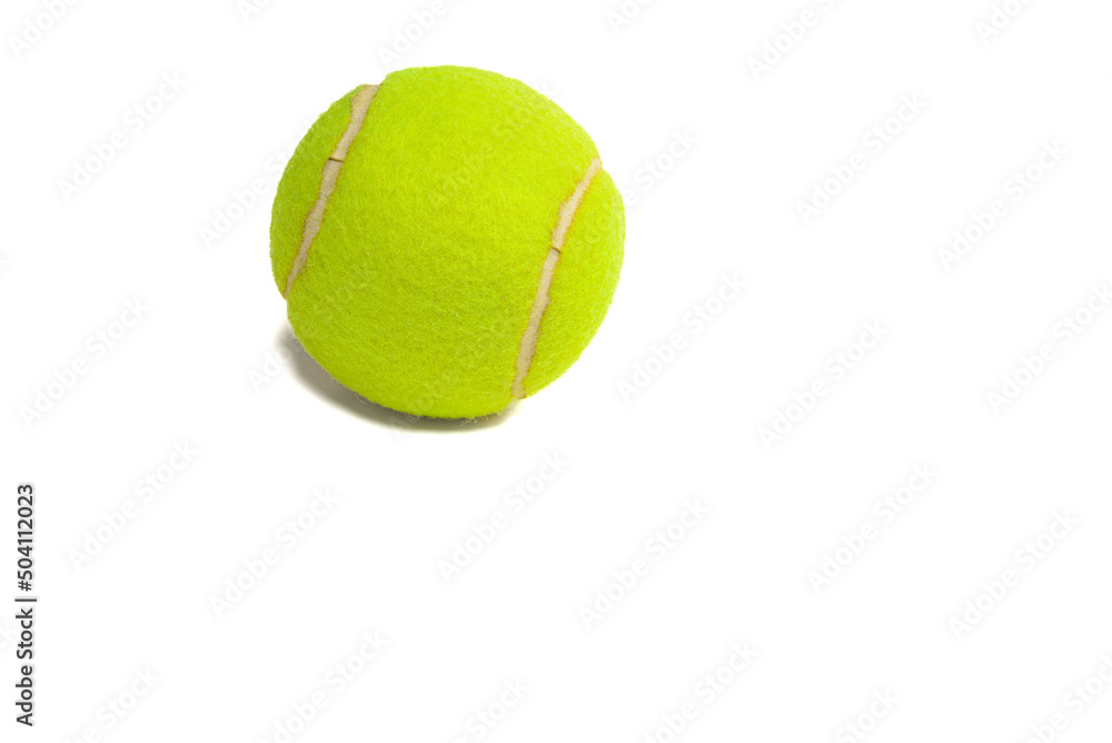 Tennis ball on a white background, in the upper left side. copy space