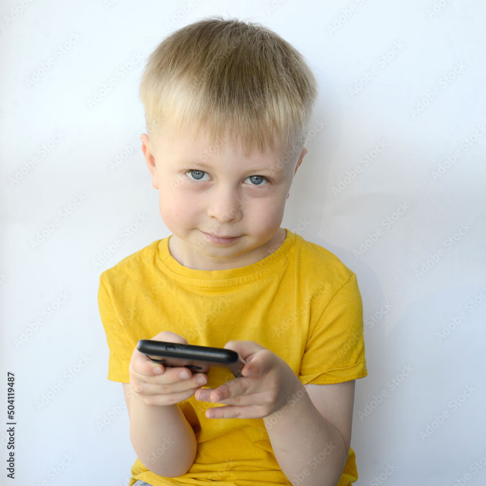 little boy uses a smart phone little boy uses a smart phone