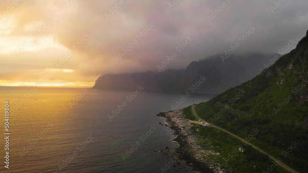 Flying along the coast of Senja Island in northern Norway at sunset Flying along the coast of Senja Island in northern Norway at sunset