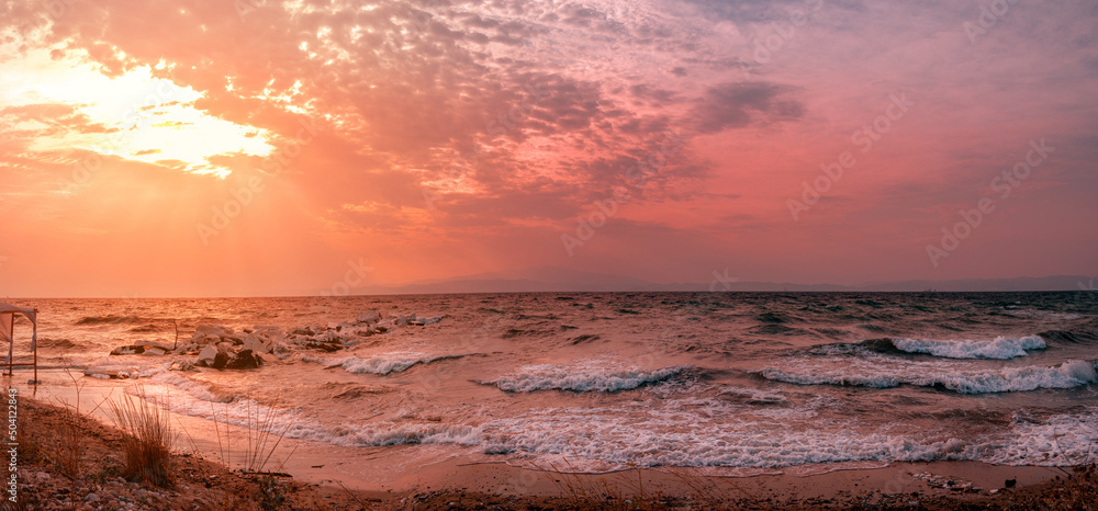 Beautiful sea wave with yellow and purple sky and sun beafore storm Beautiful sea wave with yellow and purple sky and sun beafore storm