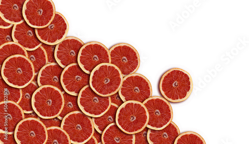 A lot of slices of pink ripe grapefruit slice on white background