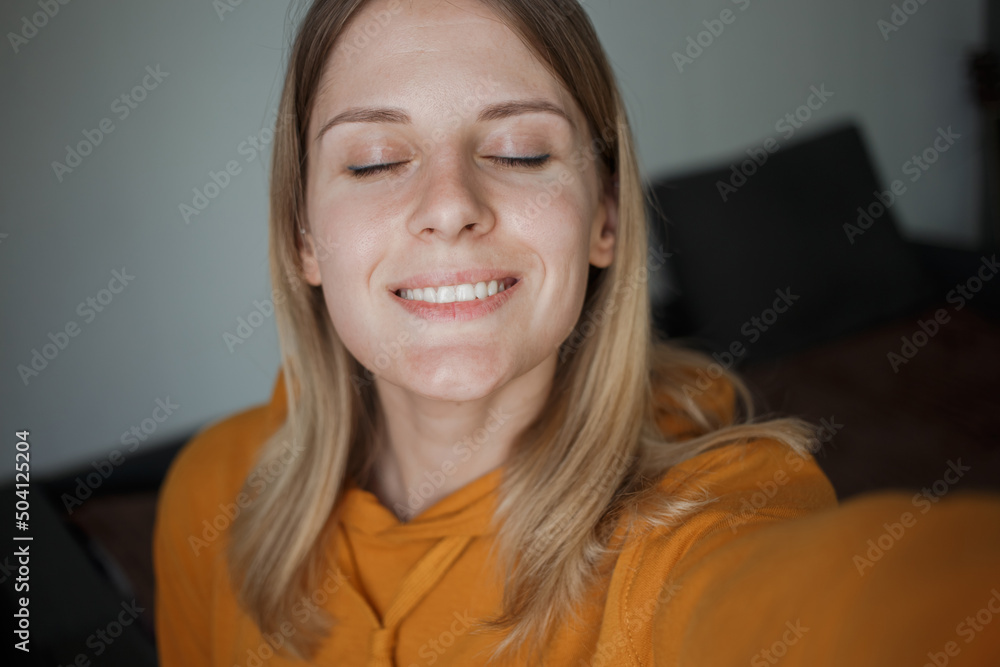 A girl takes selfies and smiles A girl takes selfies and smiles
