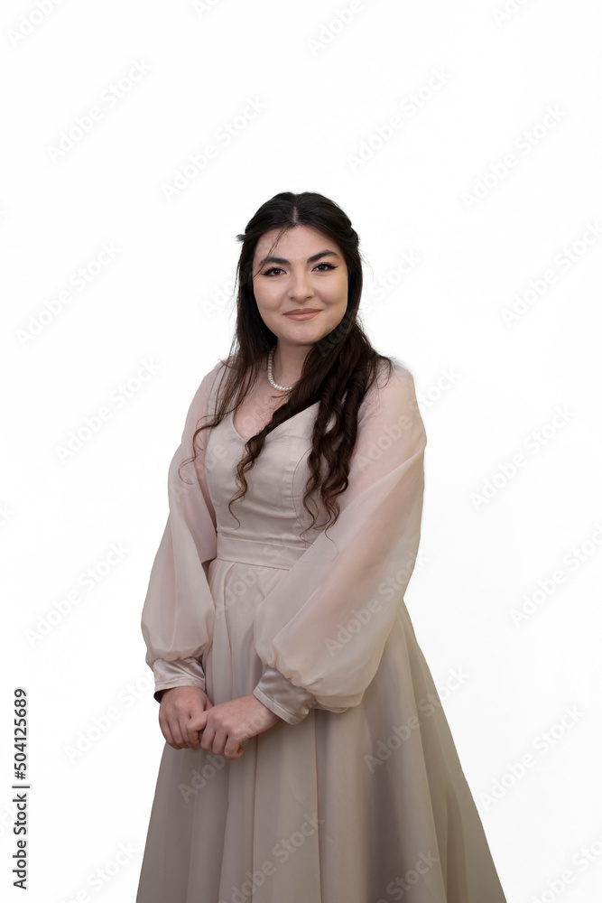 Portrait of happy beautiful woman in dress posing in studio isolated on white background. Portrait of woman with tied hands. Long black hair girl Portrait of happy beautiful woman in dress posing in studio isolated on white background. Portrait of woman with tied hands. Long black hair girl