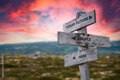 your future starts here text quote caption on wooden signpost outdoors in nature. Stock sign words theme.