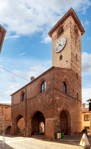 Caramagna Piemonte, Piedmont, Italy - May 10, 2022: ancient medieval Palazzo della Credenza with the clock tower in via Luigi Ornato