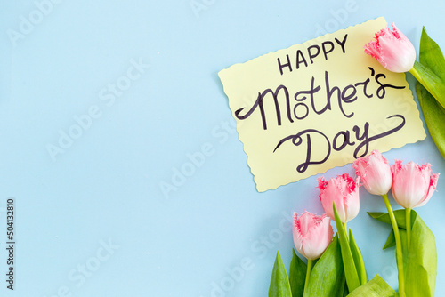 Fototapeta Naklejka Na Ścianę i Meble -  Happy Morhers Day concept - tulip flowers with greeting card
