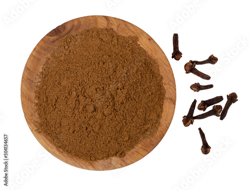 Seasoning ground cloves isolated on a white background, top-down photo